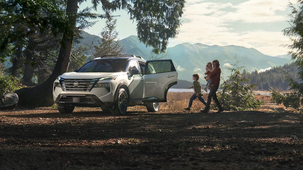 Nissan Rogue SUV on a woodland trail